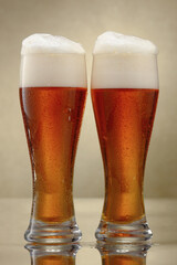 Two glasses of beer. Glasses of fresh amber craft beer. Shallow depth of field