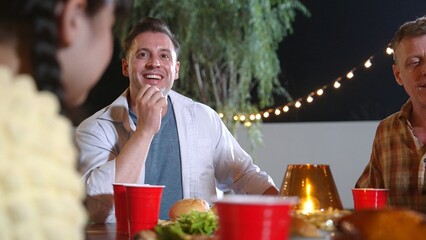 Family gather for holiday celebration. Focus grandfather, father and cute daughter together eat...