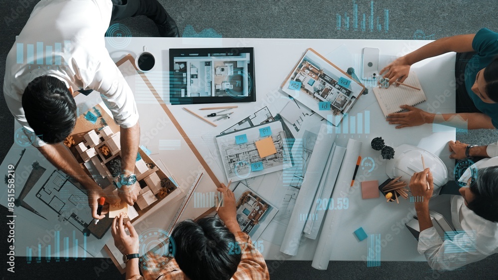 Aufkleber top down aerial view of team looking at blueprint and talking about financial chart or investment st