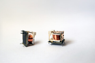 Inside of small cradle electromechanical relays. Relay is an electrically operated switch. 