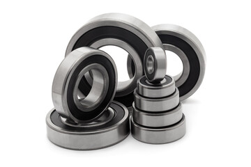 A collection of assorted tapered roller bearings of various sizes, isolated on a white background.