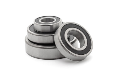 A collection of assorted tapered roller bearings of various sizes, isolated on a white background.