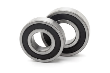 Two tapered roller bearings, isolated on a white background.
