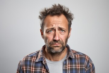 Obraz premium Portrait of a jovial man in his 40s wearing a comfy flannel shirt on plain white digital canvas