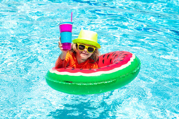 Child swim in poolside in water background. Summer vacation fun. Cute kid in swimming pool.