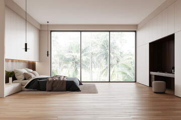 Hotel bedroom interior with sleeping space and work table, panoramic window