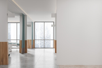 Obraz premium Modern hospital interior with white walls and large windows, depicting an empty healthcare facility. Concept of medical environment. 3D Rendering