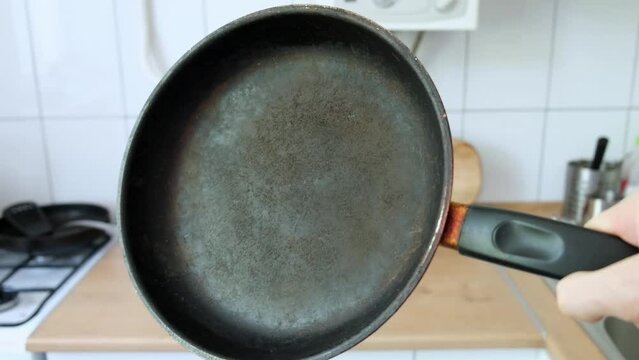 the frying pan on which the top non-stick layer of Teflon was damaged	