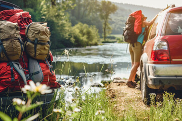 Obraz premium Backpackers by River in Morning Light