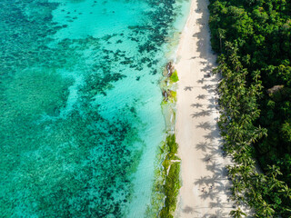 Puka Shell Beach. Clear turquoise water and ocean waves on sand. Boracay, Philippines.