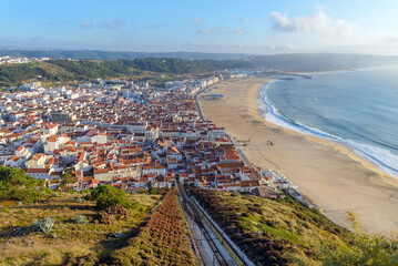 Obraz premium Aerial view of Nazare city and Praia da Nazare Beach, Portugal