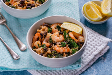 Prawn and chorizo risotto with black beans and calvo nero
