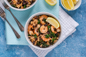Prawn and chorizo risotto with black beans and calvo nero