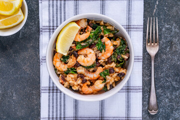 Prawn and chorizo risotto with black beans and calvo nero
