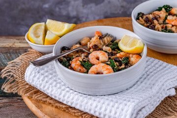 Prawn and chorizo risotto with black beans and calvo nero