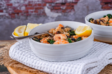 Prawn and chorizo risotto with black beans and calvo nero
