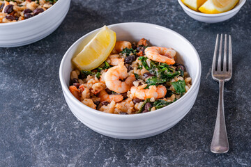Prawn and chorizo risotto with black beans and calvo nero