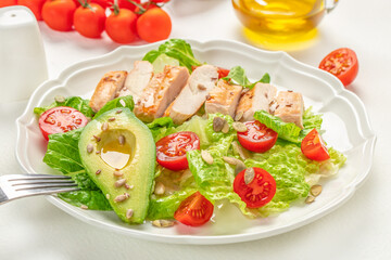 Healthy salad with grilled chicken, tomato, avocado, lettuce. Healthy and detox food concept. Ketogenic diet