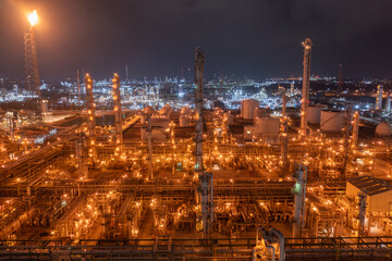 Fototapeta premium Elevated Night View of an Oil Refinery Complex