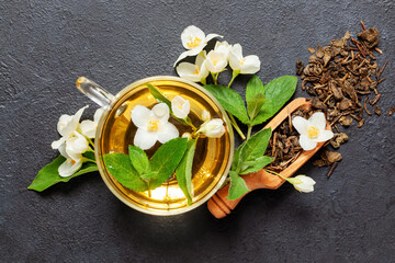 Tea with jasmine and mint in a cup. Ceremony concept. Top view