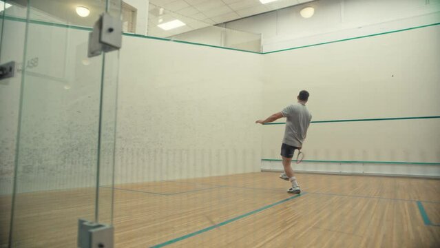 Squash game seen through the glass