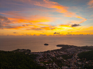 aerial view colorful cloud in sunset looked strangely beautiful. Horizon dramatic twilight sky and cloud sunset background. amazing sky at sunset scenery sunset above the island at Kata beach Phuket.