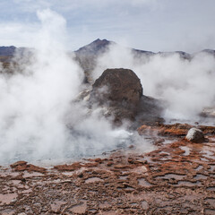 Fototapeta premium San Pedro de Atacama, Chile - Dec 2, 2023: Early morning at the volcanic El Tatio Geysers in the Atacama Desert