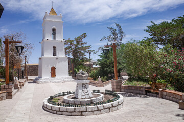 Obraz premium Atacama, Chile - Dec 1, 2023: Historic colonial bell tower of the Iglesia de San Lucas church, Tocanao