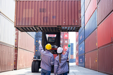 Portrait of an engineer inspecting products using a barcode scanner. Container import and logistics concept