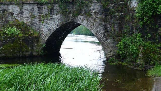 Medieval bridge on the Mi&ntilde;o River in "As Insuas do Mi&ntilde;o" in the municipality of R&aacute;bade. Santiago's road. Lugo. Galicia. Spain. Europe