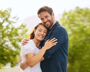Couple, hug and bonding in garden portrait, connection and romance in relationship or affection. People, safety and embrace for commitment to marriage in outdoor nature, support and countryside