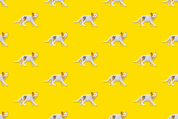 Toy Cat on Yellow Background Pattern