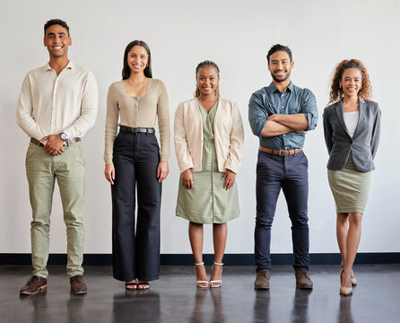 Happy, portrait and business people with confidence in waiting room for interview, career or job opoortunity. Creative group of young employees, interns and smile in row, line or startup at workplace