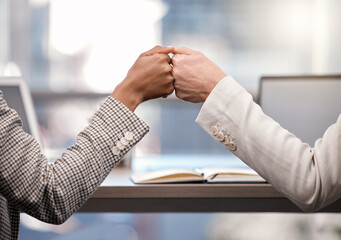 Business, woman and hands in office with fist bump for motivation, project partnership and corporate victory. Female employees, together and support in workplace with accomplishment and achievement.