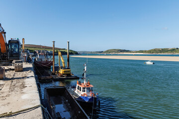 Padstow South Quay, Cornwall, England UK and the Camel estuary on a sunny day.