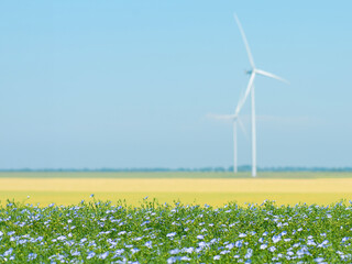 Background with wind power generators. Green energy. Renewable energy sources.