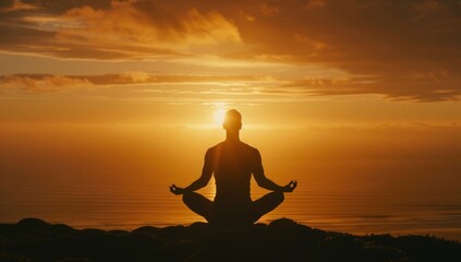 silhouette of a person meditating in the sunset
