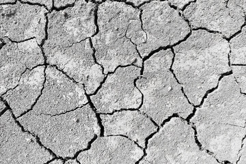 Wall texture soil dry crack pattern of drought lack of water of nature brown old broken background.