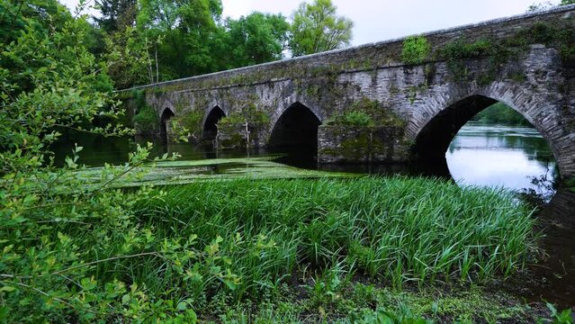 Medieval bridge on the Mi&ntilde;o River in "As Insuas do Mi&ntilde;o" in the municipality of R&aacute;bade. Santiago's road. Lugo. Galicia. Spain. Europe