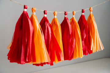 red paper tassel garland for holiday decor