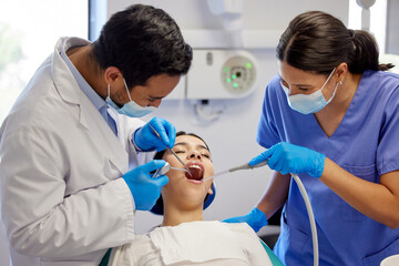 Dentist, team and oral care with patient for healthcare, wellness and teeth whitening in practice....