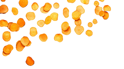 Top view of sliced carrots scattered on a black background. Perfect for healthy eating, organic food, and kitchen themes.