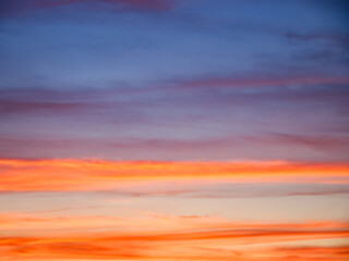 A picturesque view of the evening sky&rsquo;s vibrant yet calming colors; perfect for desktop wallpapers or screensavers.