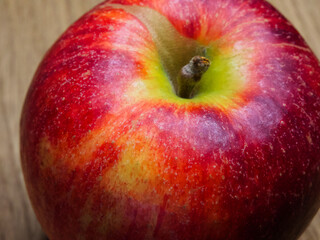 Vibrant Red Apple. A bright red apple with water droplets, symbolizing freshness.