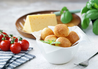 traditional Italian arancini with cheese and basil