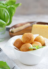 traditional Italian arancini with cheese and basil