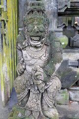 Stone stautue in Ubud Water temple