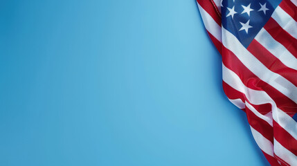American flag on a blue background, providing ample copy space for independence day greetings or patriotic messages
