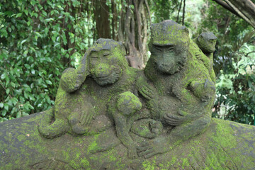 old stone statue of two monkeys