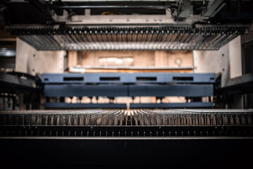 Pipes of industrial suction lifting equipment inside a factory.